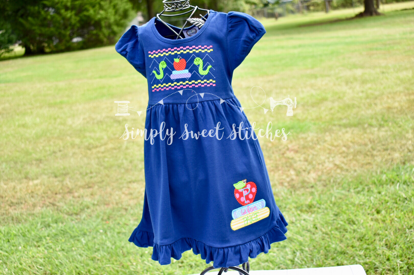 1105 - FAUX SMOCK BOOKWORM - APPLIQUE EMPIRE DRESS