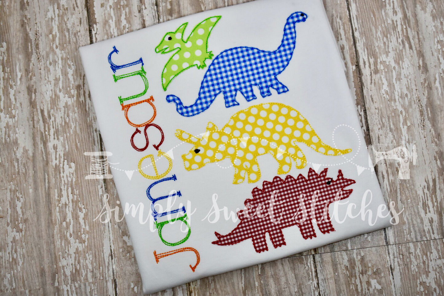 1114 - STACKED DINOSAURS - APPLIQUE CHILD SHIRT