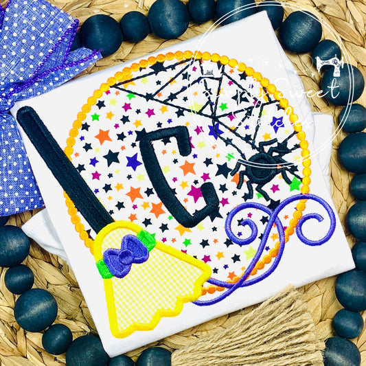 2342 - WITCH'S BROOM CIRCLE WITH INITIAL - APPLIQUE CHILD SHIRT