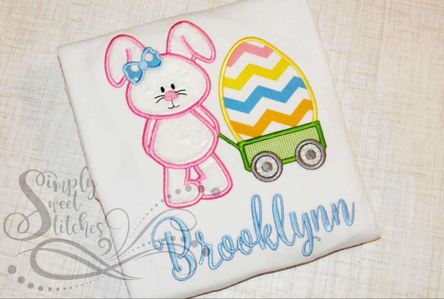 1012 - GIRL EASTER BUNNY WITH EGG IN WAGON - APPLIQUE CHILD SHIRT