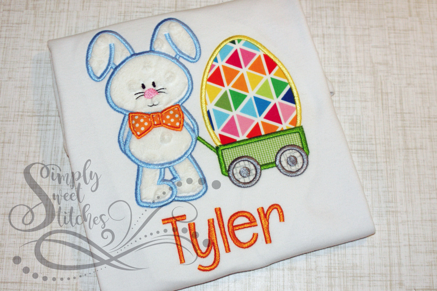 1013 - BOY EASTER BUNNY WITH EGG IN WAGON - APPLIQUE CHILD SHIRT