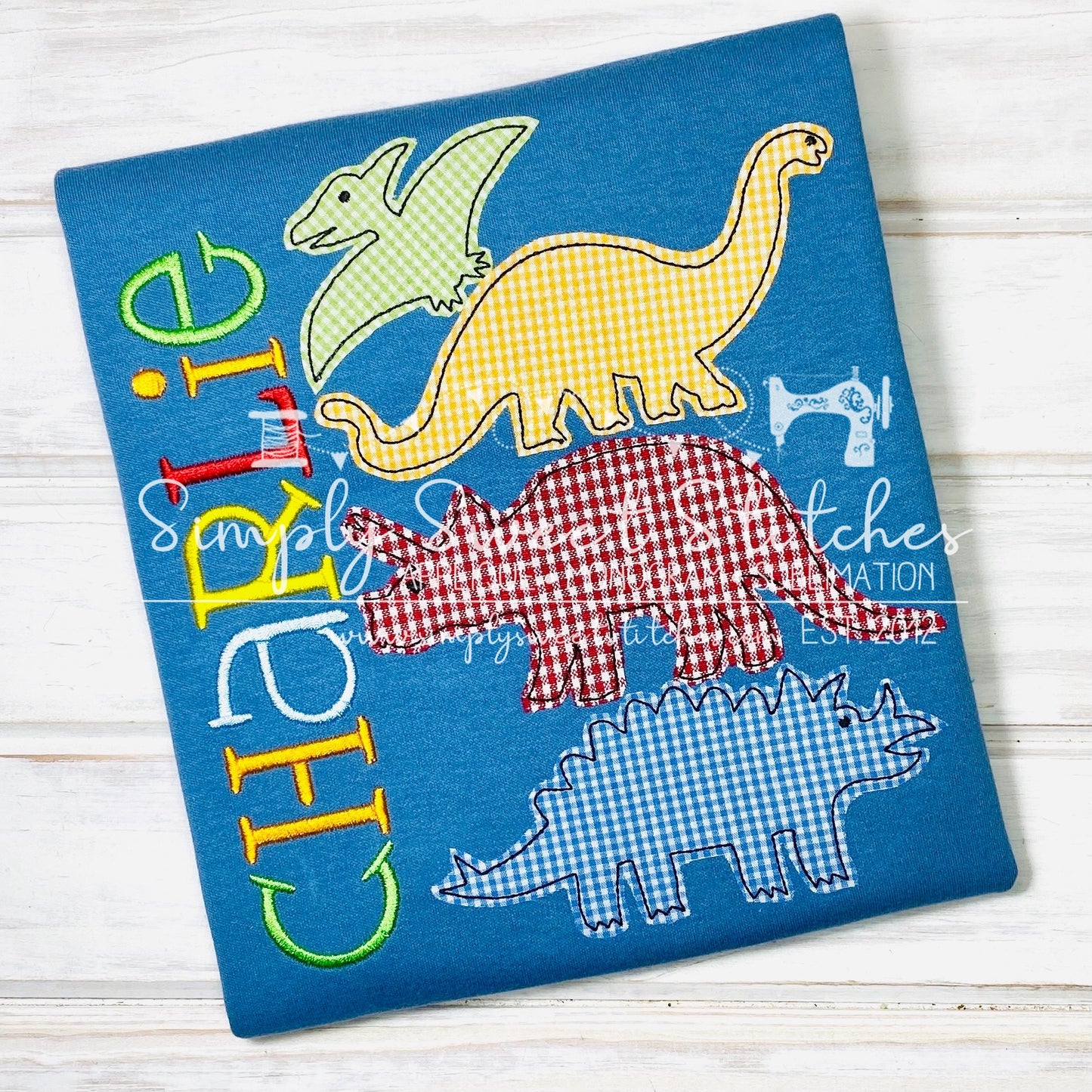 1114 - STACKED DINOSAURS - APPLIQUE CHILD SHIRT