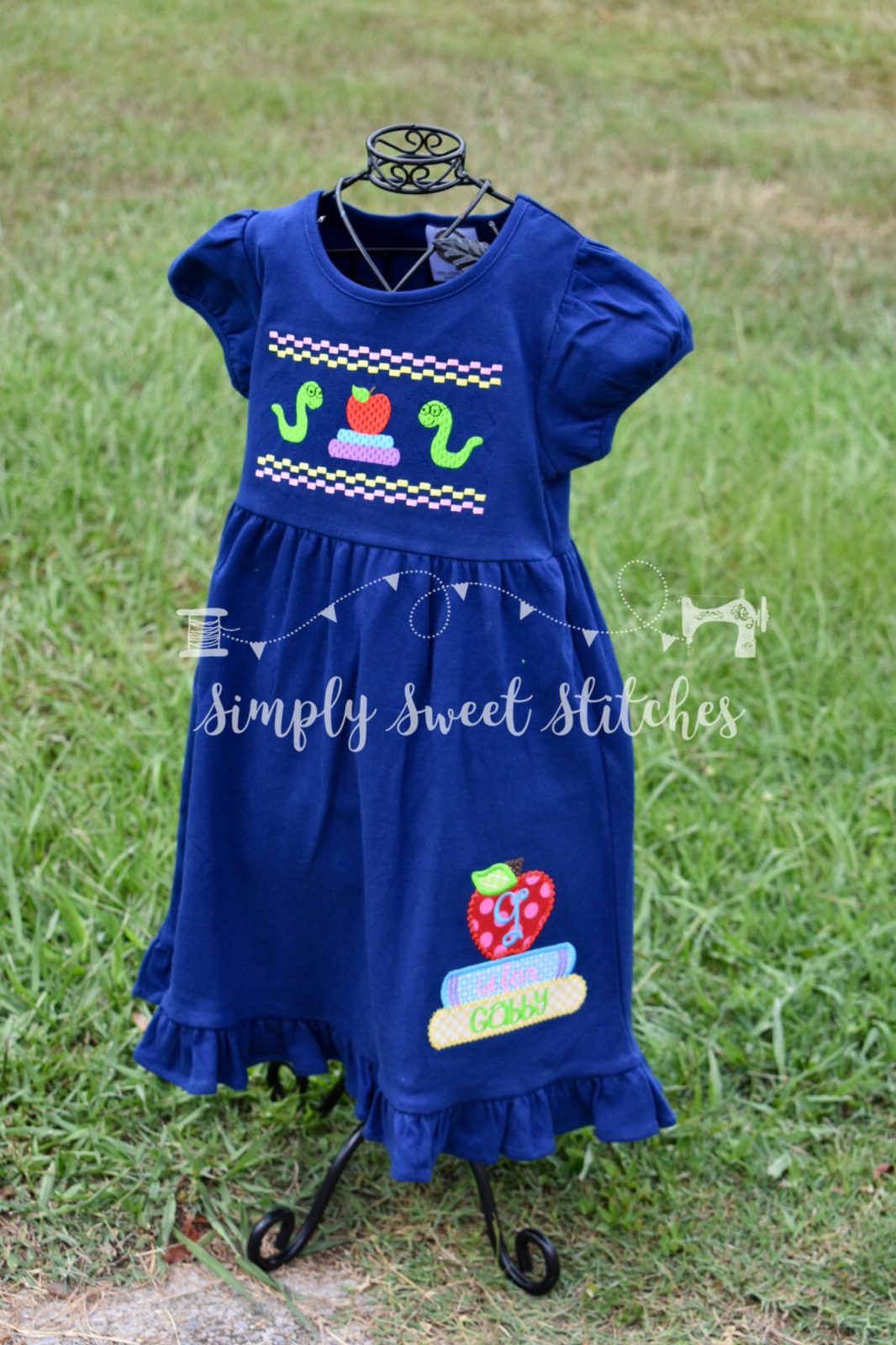 1105 - FAUX SMOCK BOOKWORM - APPLIQUE EMPIRE DRESS