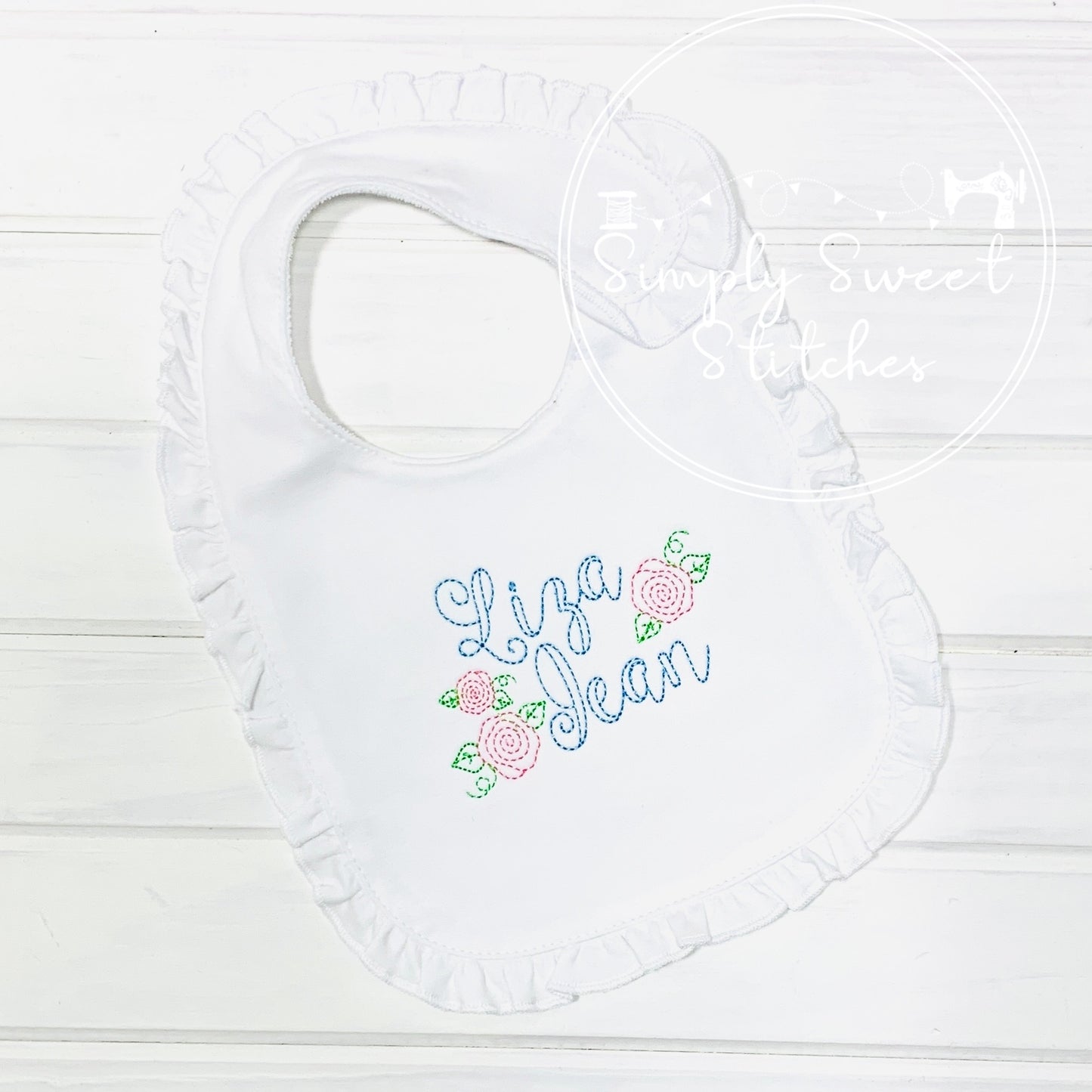 1392 - NAME WITH FLOWERS - EMBROIDERY BIB