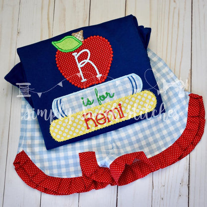 1110 - STACKED BOOKS WITH APPLE - APPLIQUE CHILD SHIRT