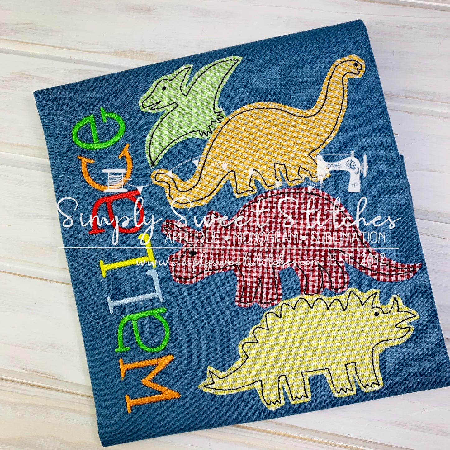 1114 - STACKED DINOSAURS - APPLIQUE CHILD SHIRT